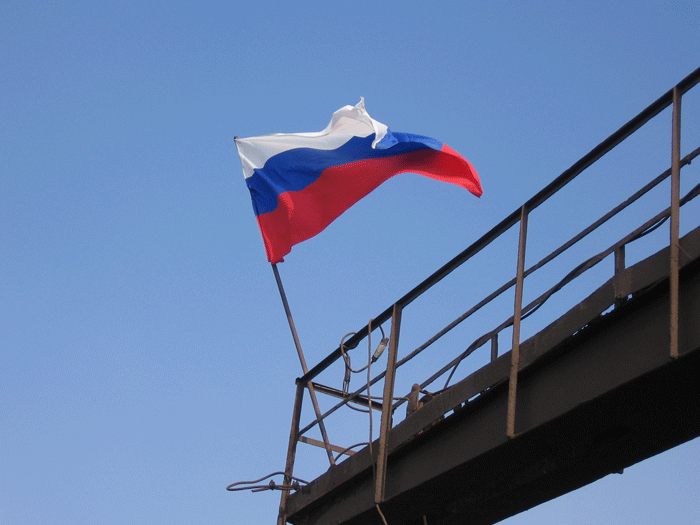 National flag of Russia over a blast furnace on the occasion of the repair termination