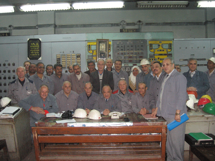 The  group of the Russian and Egyptian experts on a control panel of the  blast furnace before certificate signing about the repair termination