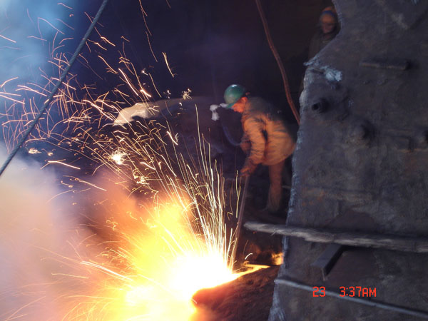 Metal works in Heluane. Egypt. Dismantle of a casing of the furnace